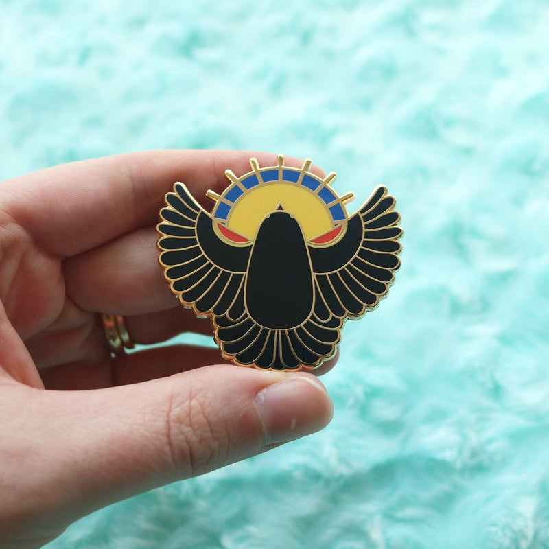 Holding Black Bird Pin