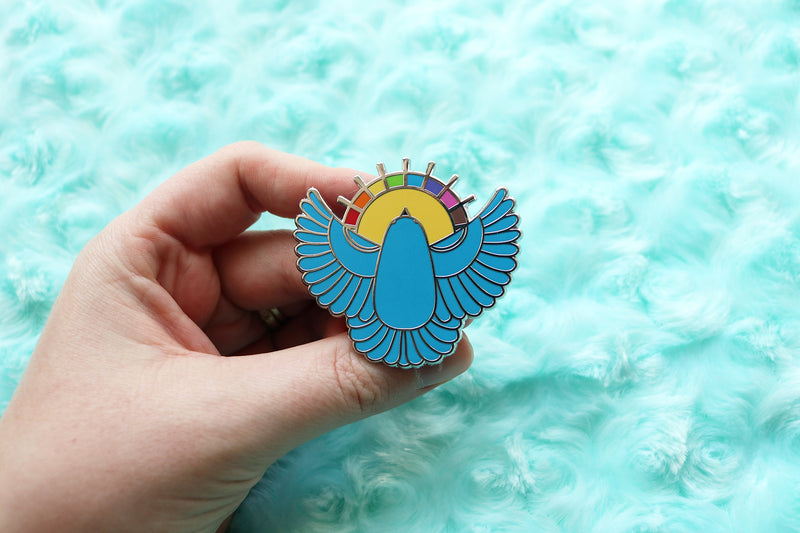 Holding Blue Bird Pin