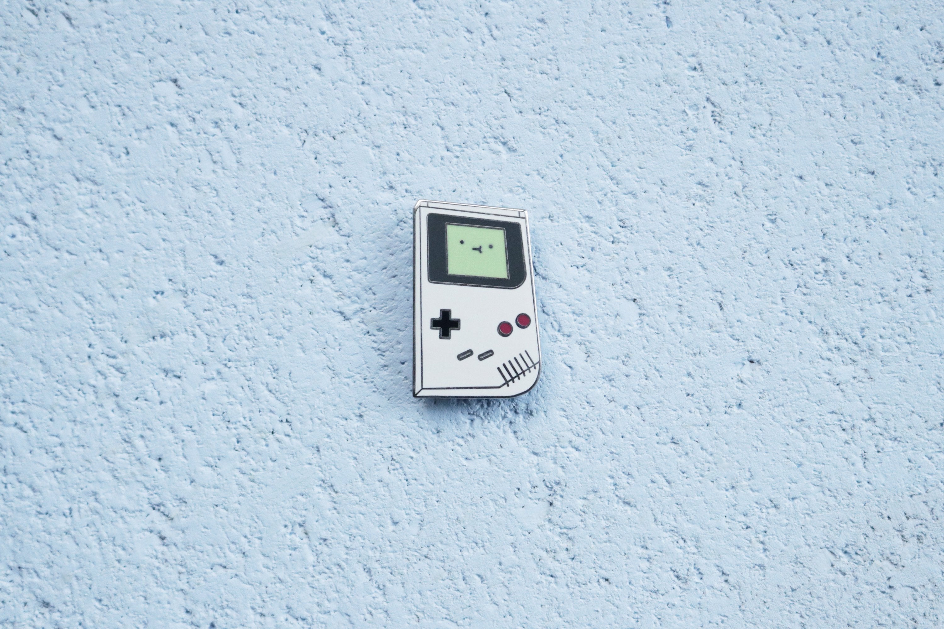 Original Game Boy with Green Screen Pin on Blue Cork Background