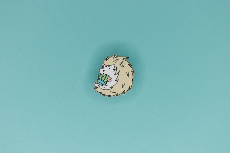 Albino Hedgehog Holding a Barrel Cactus Hard Enamel Pin by Dbl Feature